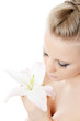 The beautiful  blonde woman with lily flower