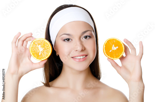 Photo: The beautiful woman with a orange The beautiful woman with a orange