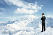 man looking to mountains