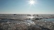 Pieces of ice moving on frozen sea