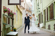 Bride and groom dancing outdoors