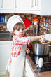 little girl plays the cook and makes a dinner