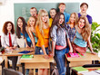 Group student near blackboard.