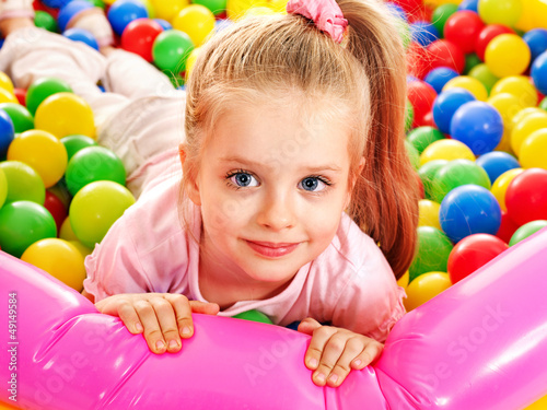 Photo: Child in colored ball. Child in colored ball.