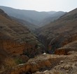 Photo: Desert canyon with flowing creek at the bottom Desert canyon with flowing creek at the bottom