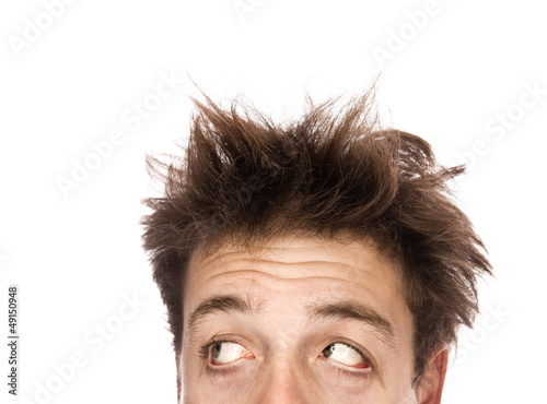 Photo: Exhausted man looking left - Isolated on white Exhausted man looking left - Isolated on white
