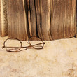 17th century book with vintage glasses
