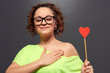 Photo: woman in glasses with red heart woman in glasses with red heart