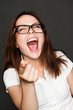 woman pointing finger and laughing