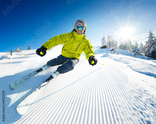 Photo: Skier on pise in high mountains Skier on pise in high mountains