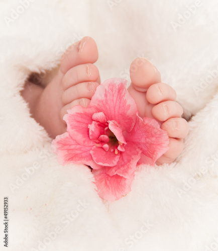 Photo: Babyfeet with pink flower Babyfeet with pink flower