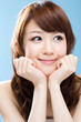 Photo: Beautiful asian woman on blue background Beautiful asian woman on blue background