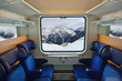 Photo: Interior of train and mountains in window Interior of train and mountains in window