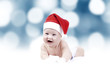 Baby in New Years hat on the bokeh background