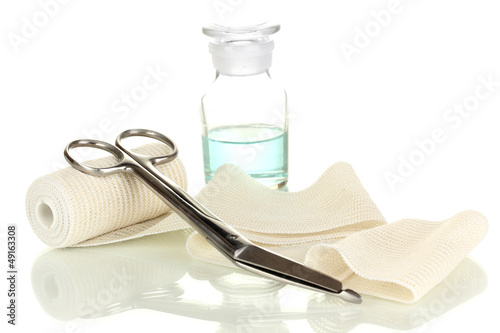 Photo: First aid kit for bandaging isolated on white First aid kit for bandaging isolated on white