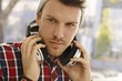 Closeup portrait of young guy with headphones