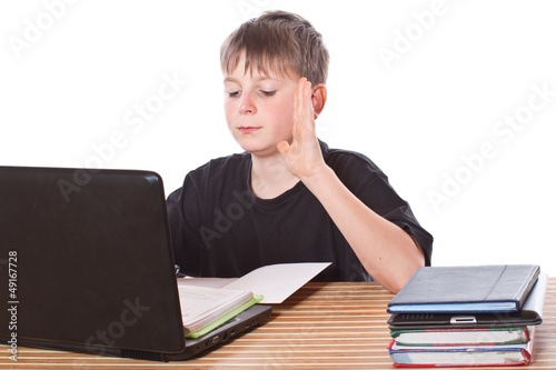 Photo: schoolchild learns lessons schoolchild learns lessons