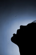 Foto: Silhouette of a girl in the mouth where a drop of water falls Silhouette of a girl in the mouth where a drop of water falls
