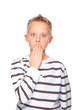 boy with hand before mouth