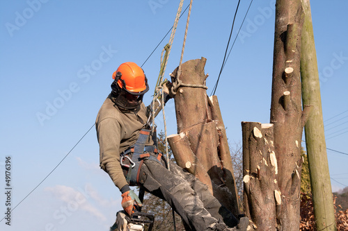 Photo: Man hanging from ropes Man hanging from ropes