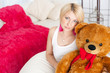 pregnant girl hugging a teddy bear