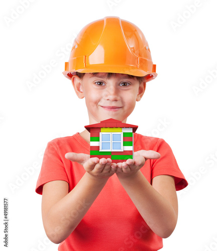 Photo: Little girl holding toy house Little girl holding toy house