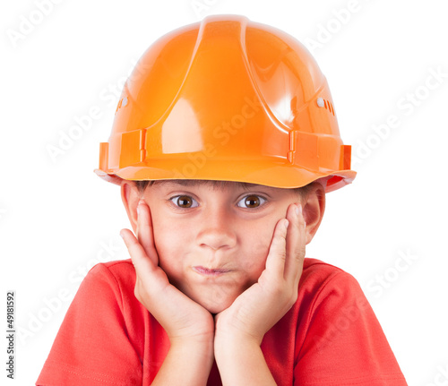 Photo: Little girl in a protective helmet Little girl in a protective helmet