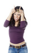 young woman showing aggressiveness with horns