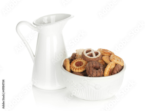Photo: Various cookies in bowl and milk jug Various cookies in bowl and milk jug