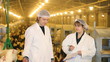 Vet and Farmer on Chicken Farm