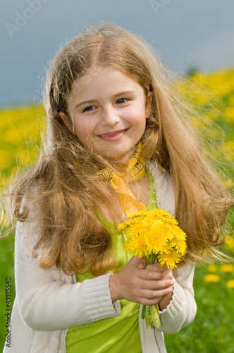 Photo: Allergy season, pollen - lovely girl with dandelion flowers Allergy season, pollen - lovely girl with dandelion flowers