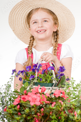 Photo: Gardening - lovely gardener with flowers seedlings Gardening - lovely gardener with flowers seedlings