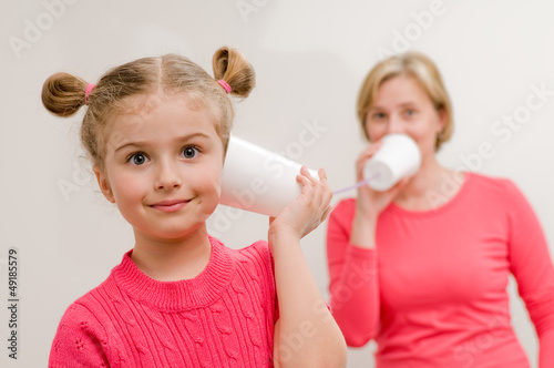 Photo: Communication concept - playing with mug phone Communication concept - playing with mug phone