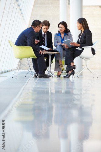Photo: Businesspeople Having Meeting In Modern Office Businesspeople Having Meeting In Modern Office