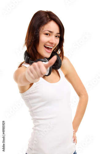Photo: Portrait of attractive young woman showing a thumbs up Portrait of attractive young woman showing a thumbs up