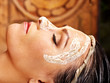 Photo: Woman having mask at ayurveda spa. Woman having mask at ayurveda spa.