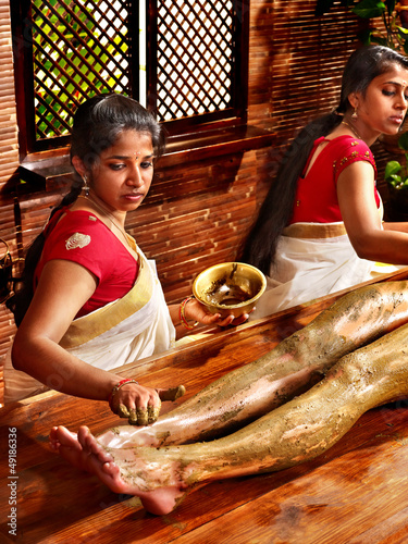 Photo: Woman having Ayurvedic feet spa massage. Woman having Ayurvedic feet spa massage.