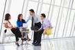 Businesspeople Having Meeting In Modern Office
