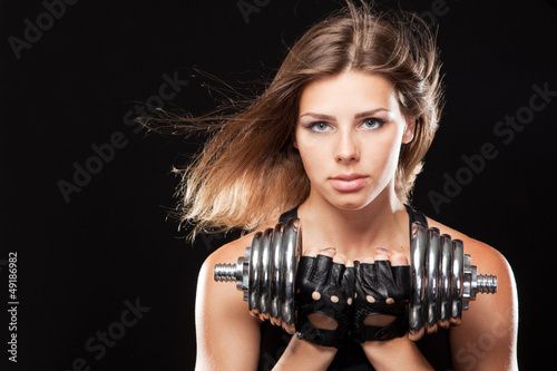 Photo: Slim woman with dumbbells Slim woman with dumbbells