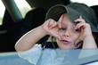 Mischievous little boy gesturing at the camera