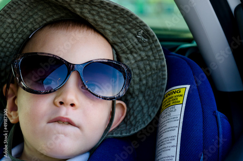 Photo: Little boy wearing Mums sunglasses Little boy wearing Mums sunglasses