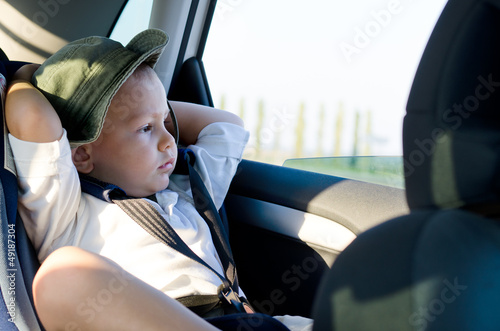 Photo: Little boy in a child safety seat Little boy in a child safety seat