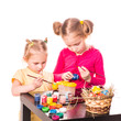 Two happy kids painting easter eggs. Happy Easter