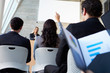 Businesswoman Delivering Presentation At Conference