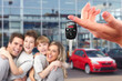 Happy family with a new car keys.