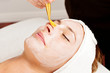 woman relaxing during a facial treatment