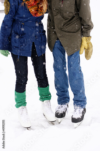 Photo: Couple wearing ice skates Couple wearing ice skates