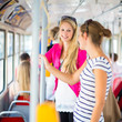 Pretty, young woman on a streetcar/tramway