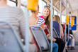 Pretty, young woman on a streetcar/tramway