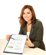 Photo: A businesswoman showing statistics results in a folder A businesswoman showing statistics results in a folder